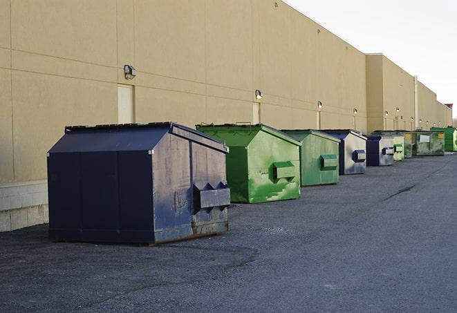 construction crew disposing of building materials in large bins in Glenview, IL